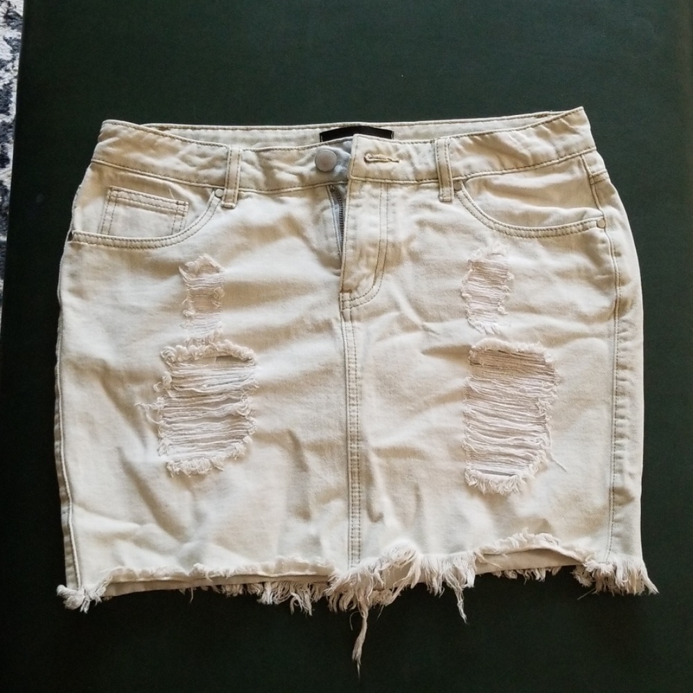 Light wash frayed bottom jean skirt